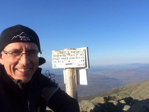 Doug at the Summit Sign