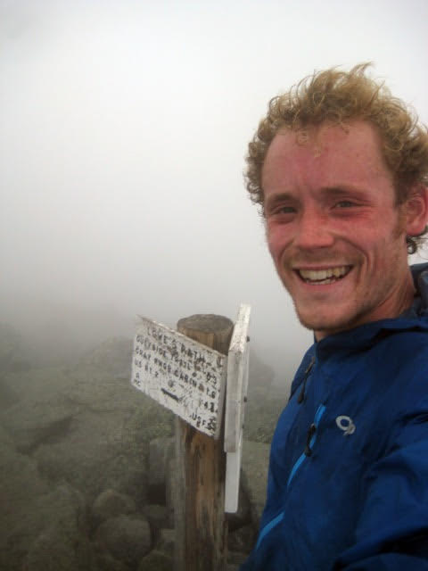 Rob is all smiles at the Summit Sign