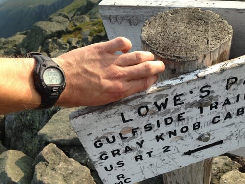 Jordan's Watch at the Summit Sign