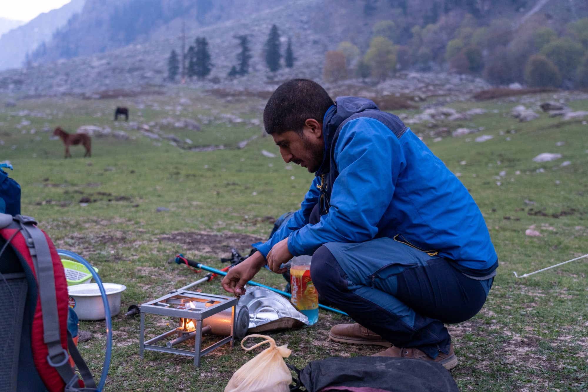 a person cooking at campsite im Mulling