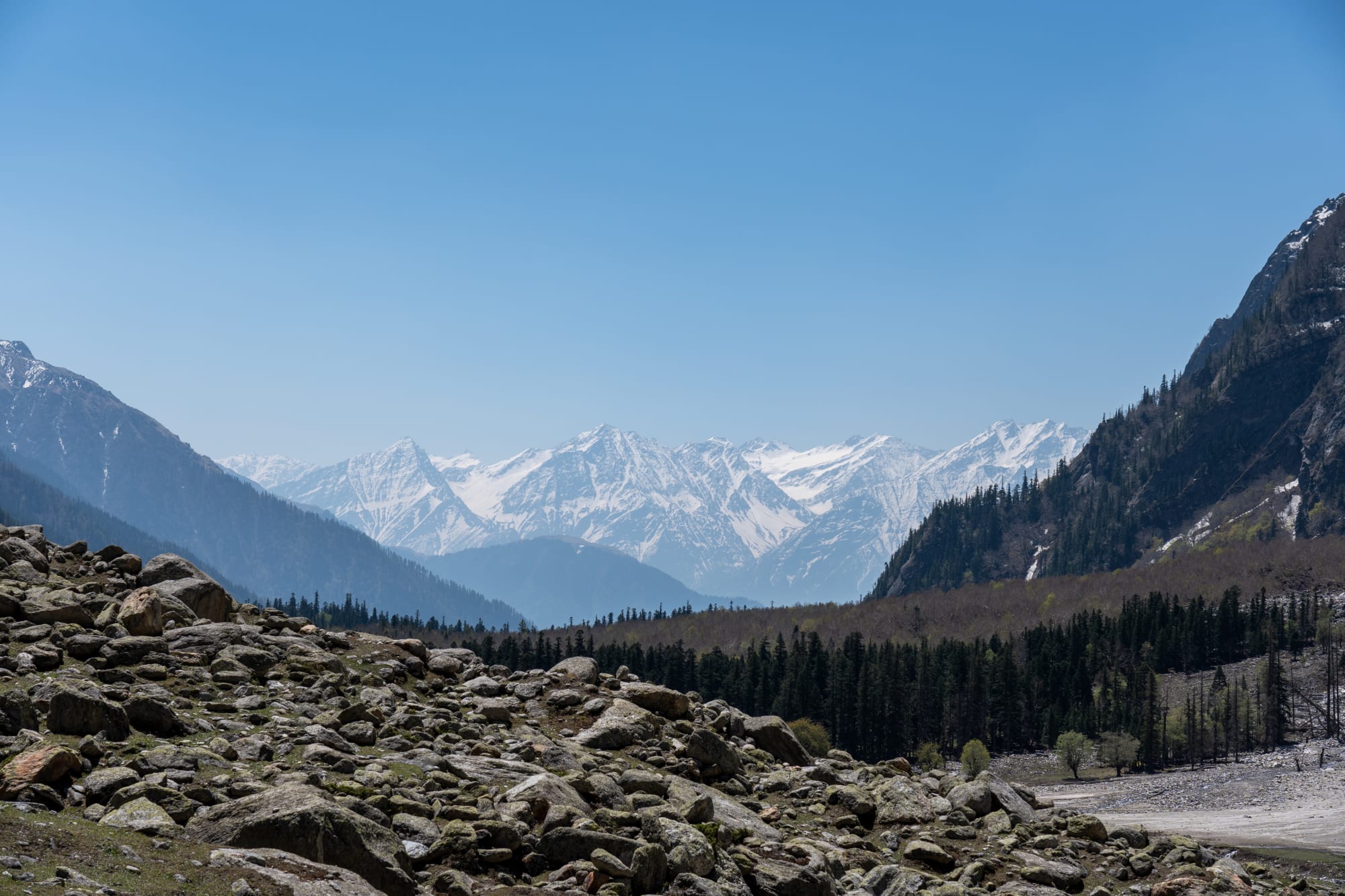 stones in the foreground with mountains in the background