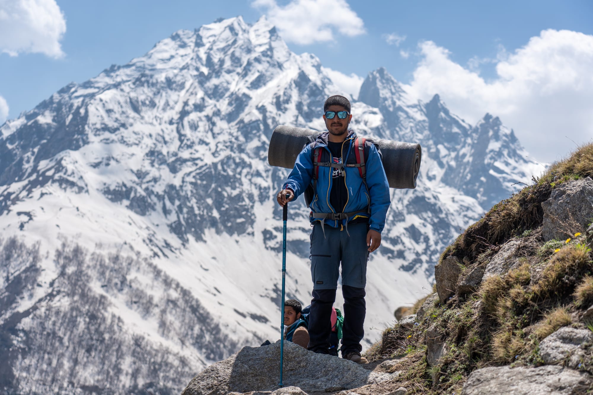 a person standing in front of a mountain covered with snow