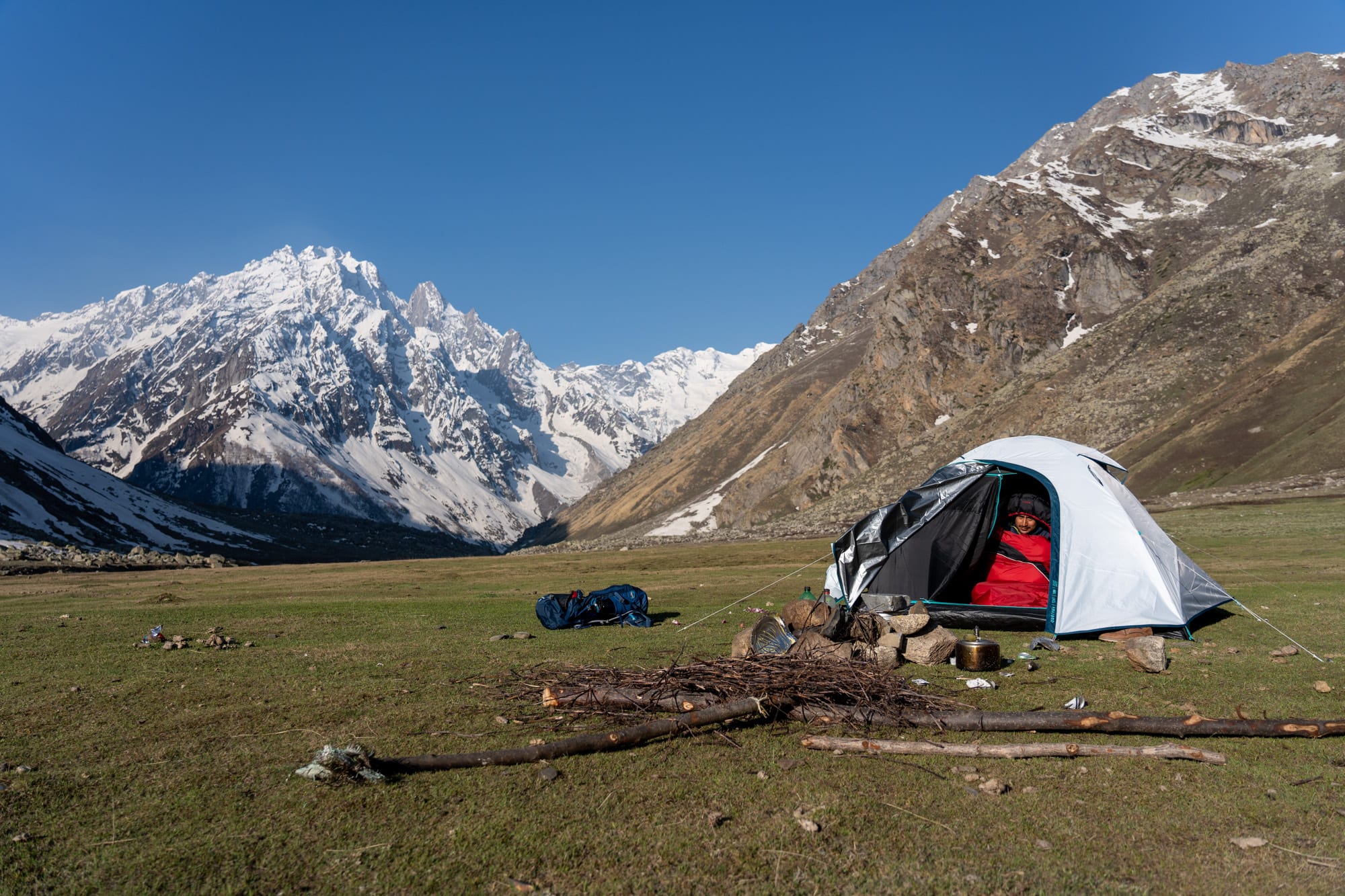 Tent at Kara lake with a person inside in his sleeping bag