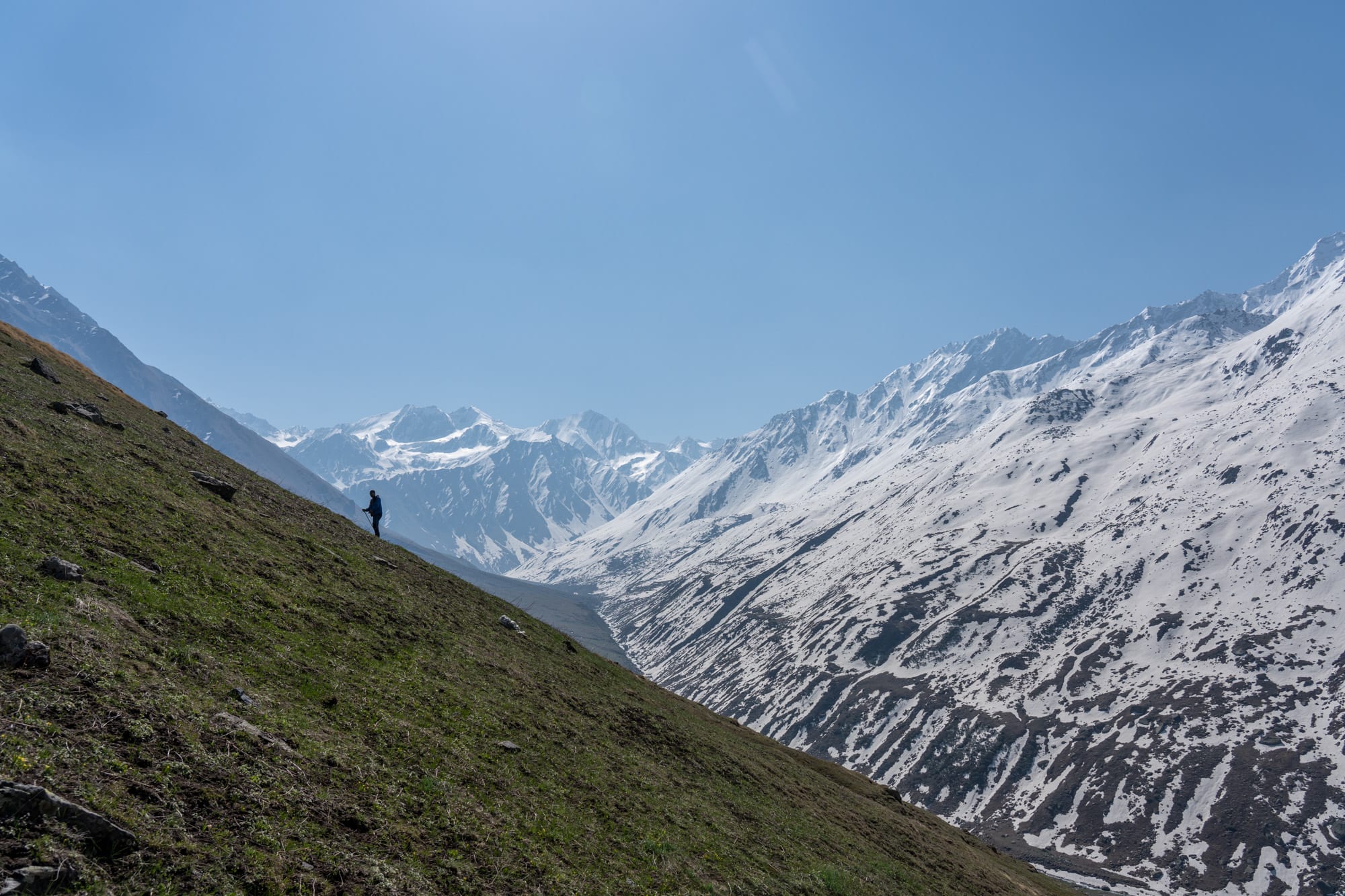 Steep ascent at Bhaba valley with swow mountains in teh abckground