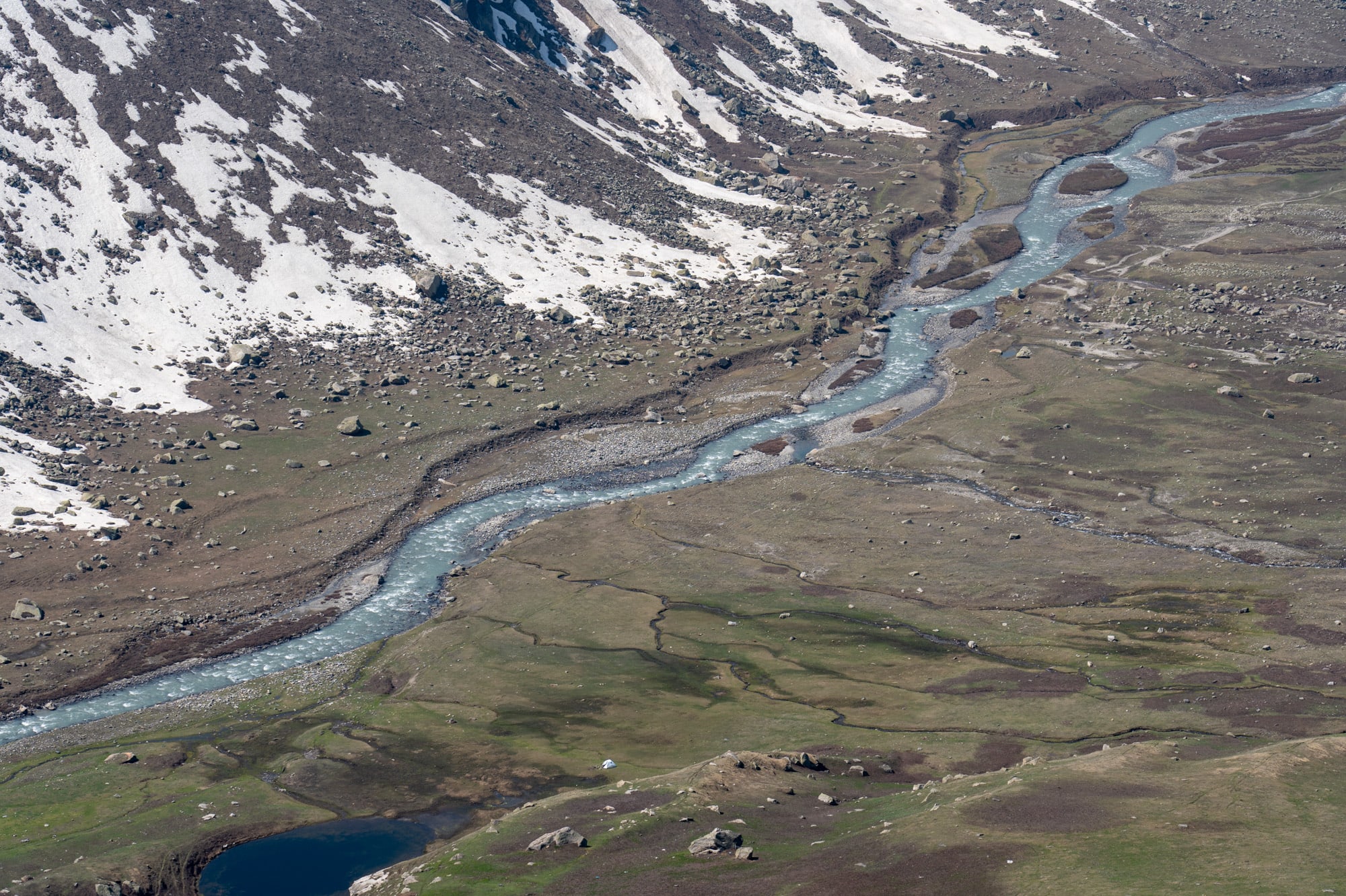 Bhaba river flowing through Bhaba valley with a tent far away