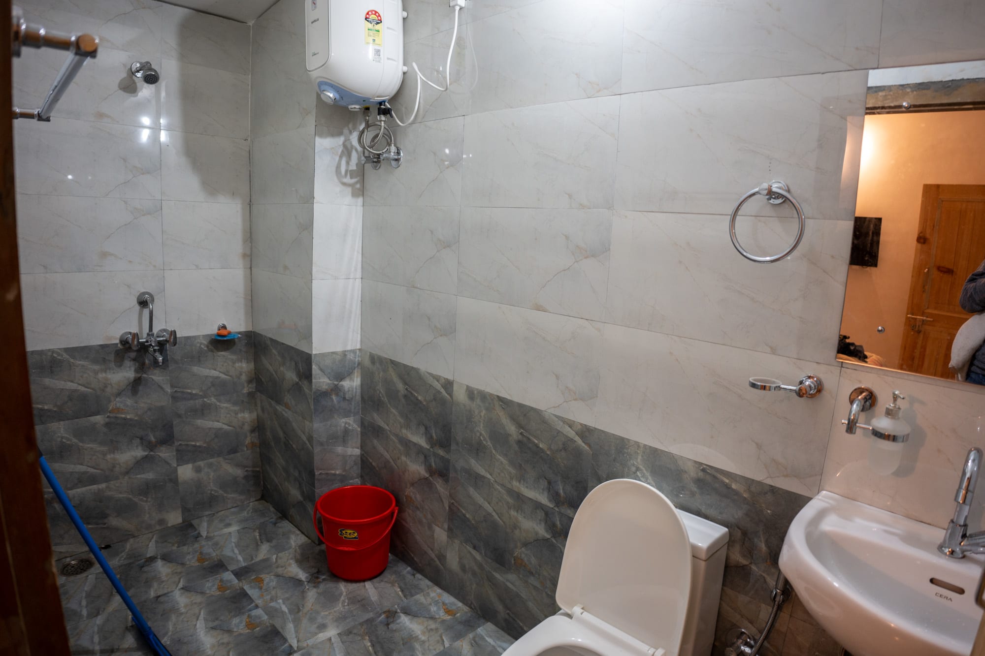 Washroom with toilet and shower