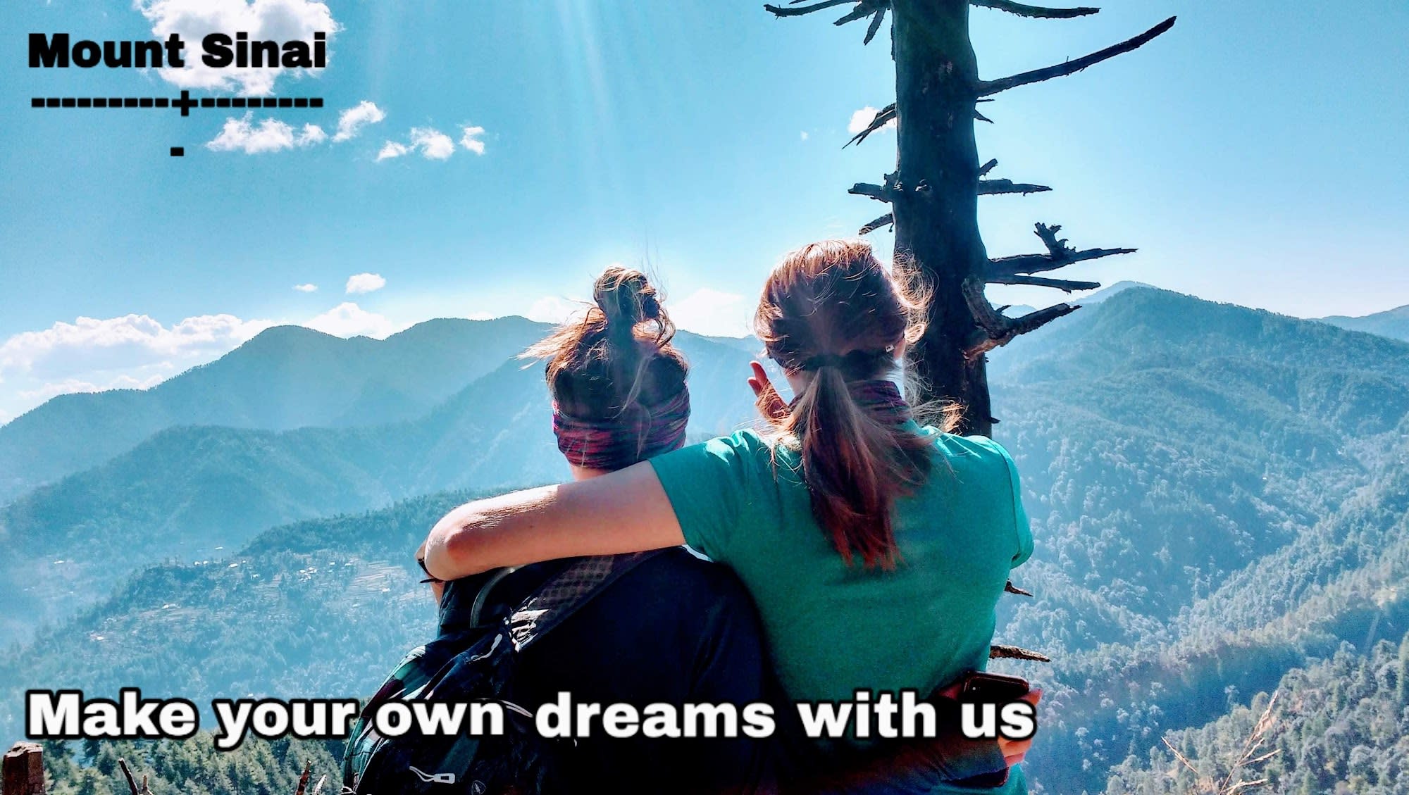 make your own dreams with us (2 woman looking at the mountins)