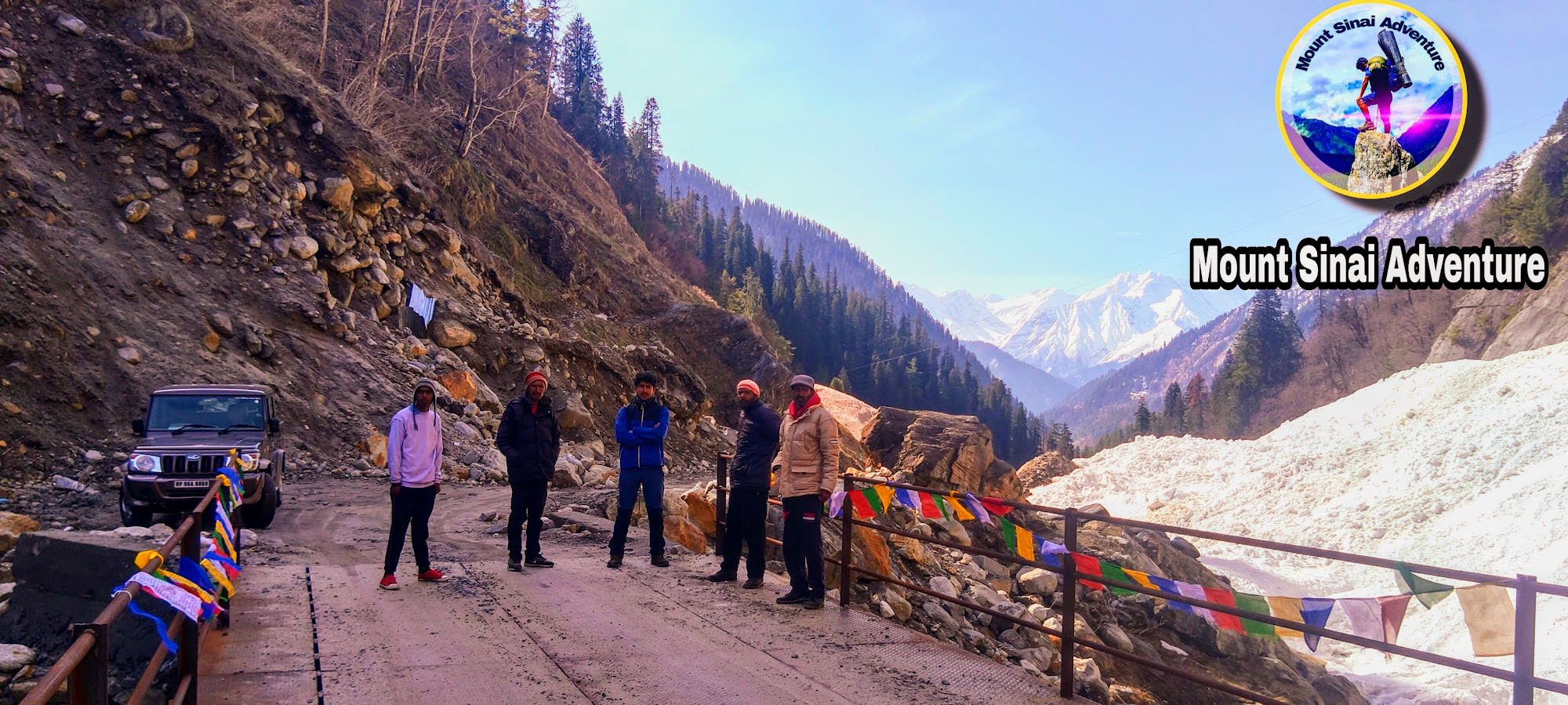 a group of people standing on a bridge