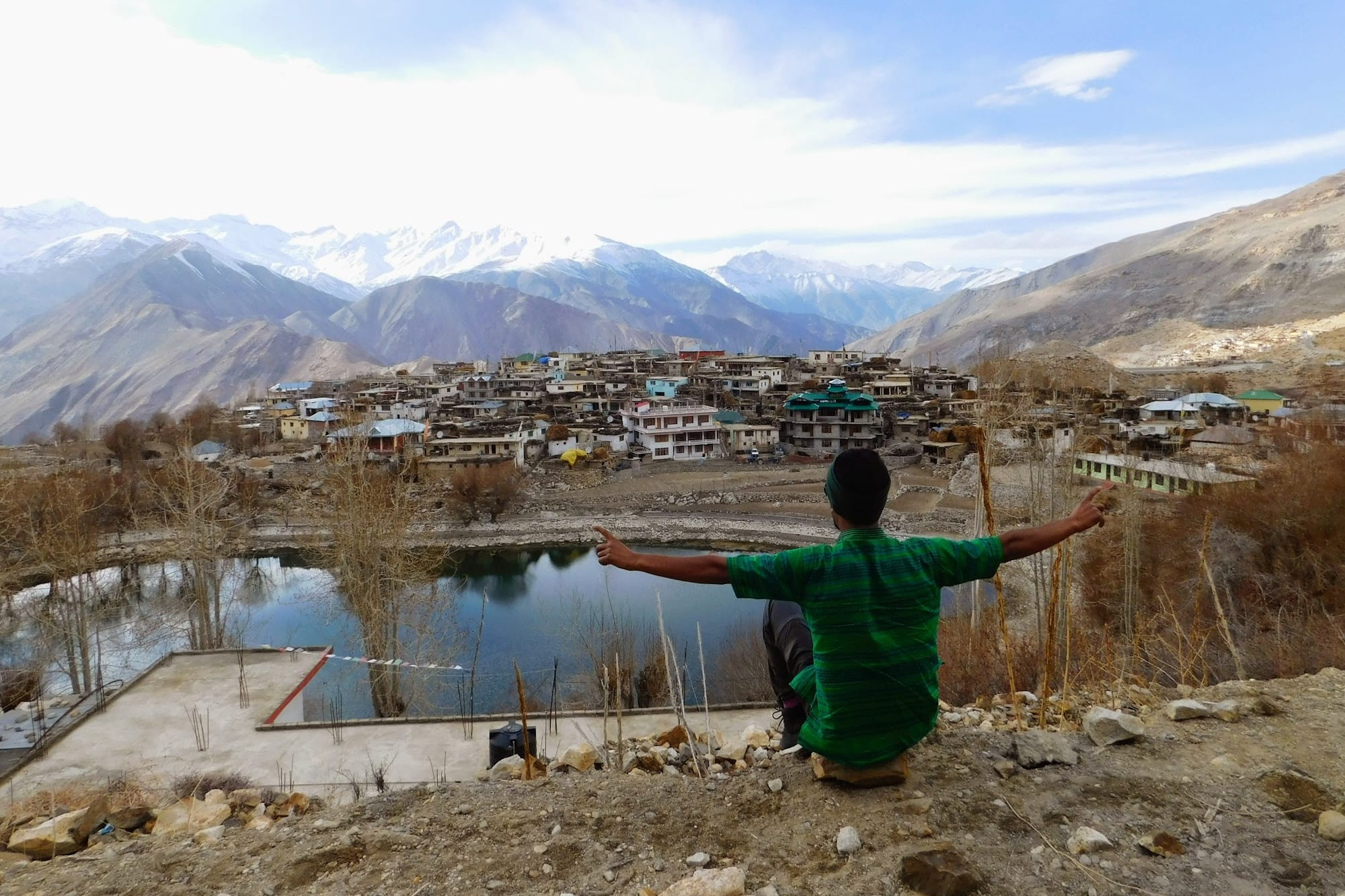 Pravesh in fromt of a village in the mountains