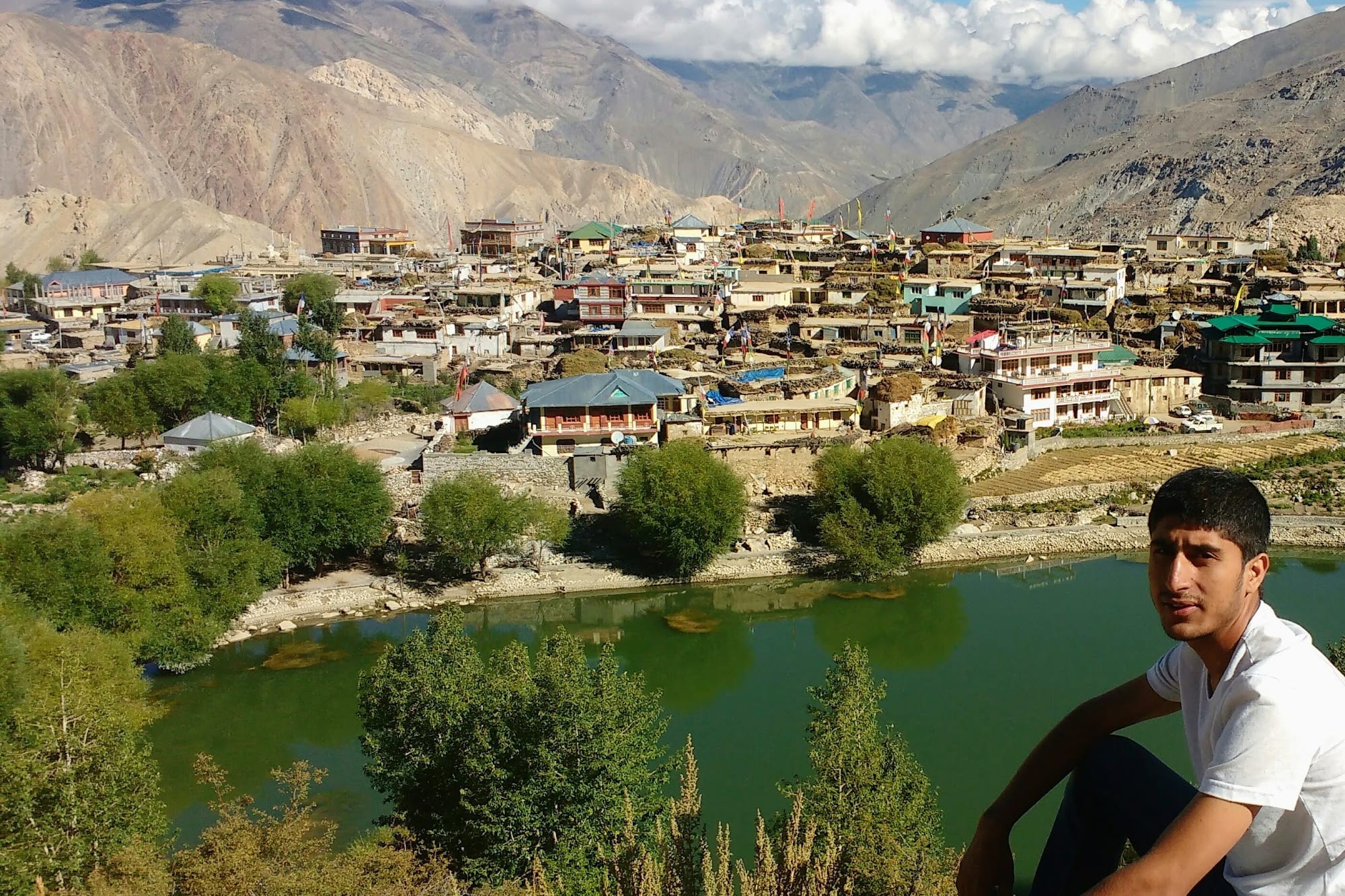 Pravesh in fromt of an village in the mountains