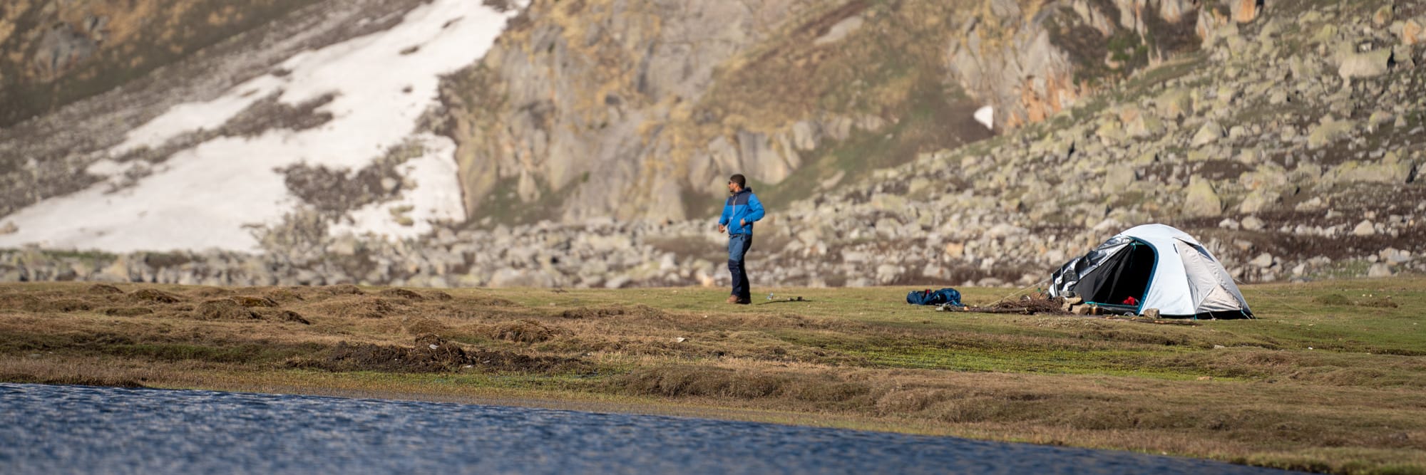 Camping at Kara lake with person outside the tent