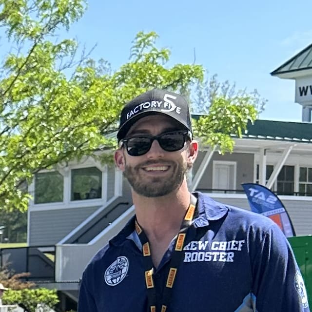 Mr. Roos with the 2023-2024 Winner's Circle Project car