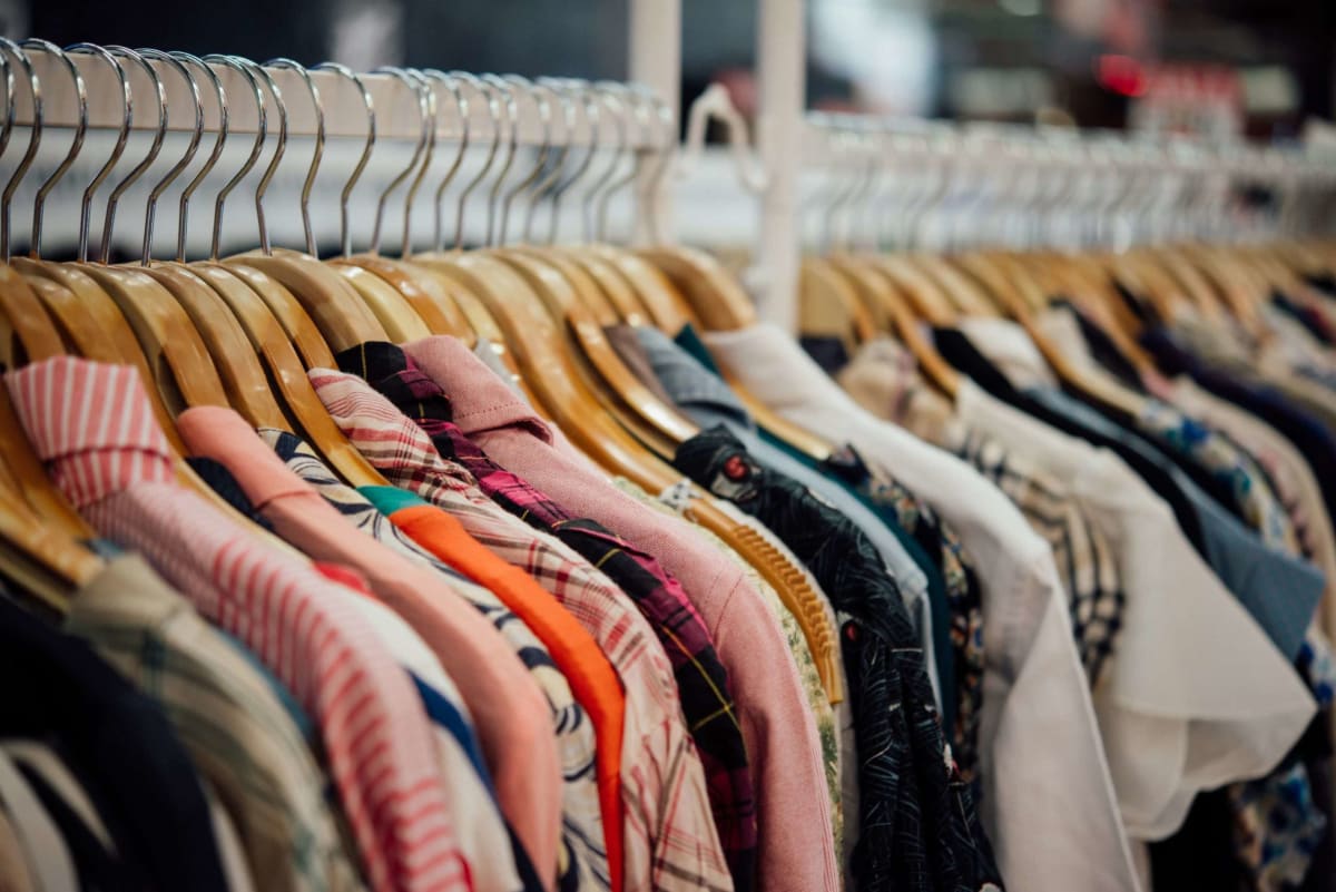 A clothing rack filled with fast fashion clothing