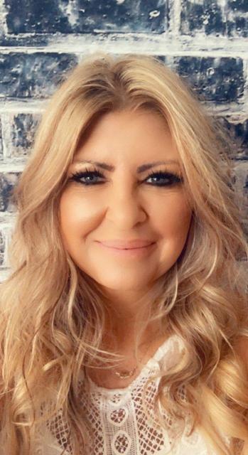 Headshot of Tedi Spain
