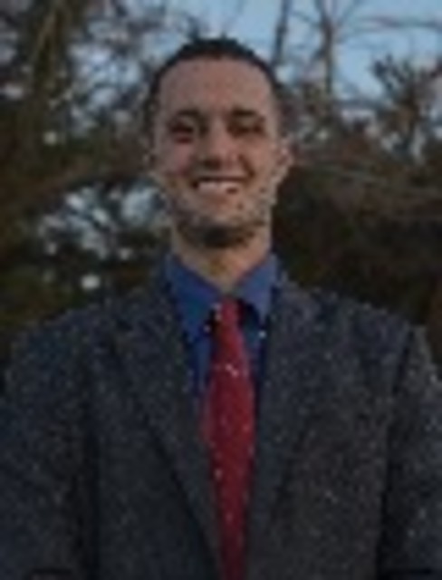 Headshot of Corey Ghiringhelli