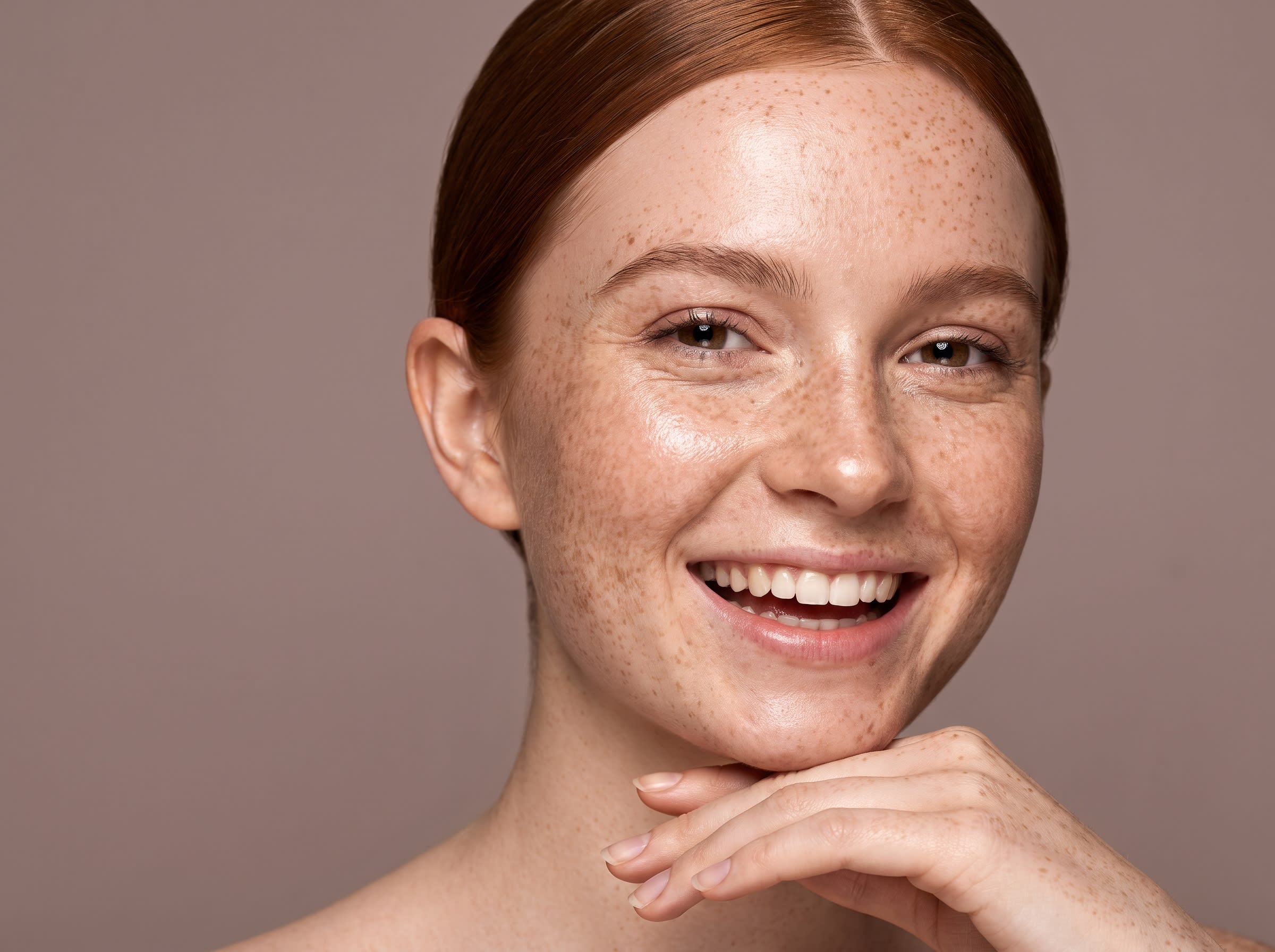 Young woman smiling with freckles
