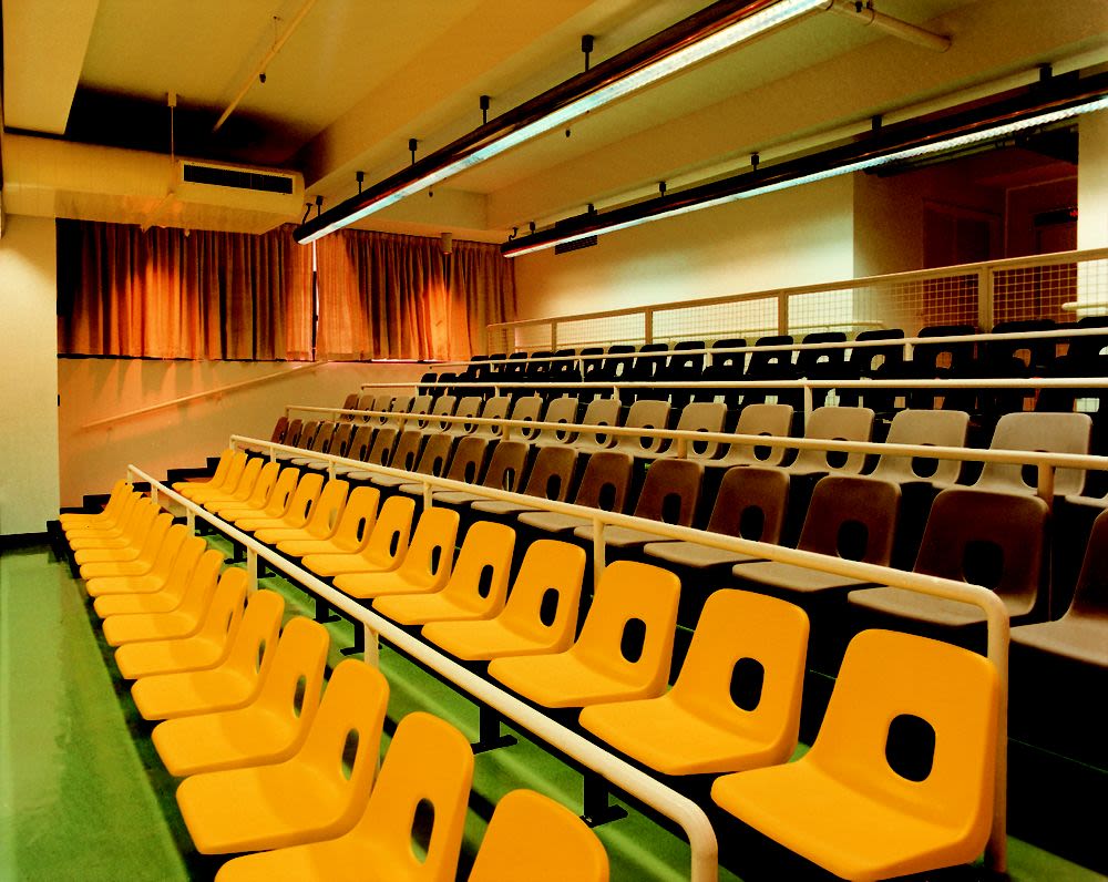 Interior photograph, room seating, St. James’ Settlement building ...