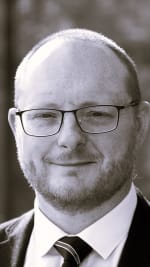 Black and white head shot of Philip Burns