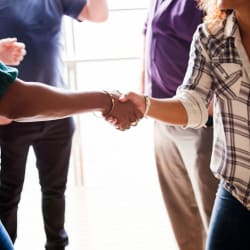 2 people shaking hands