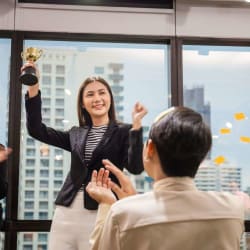 lady cheering with her award