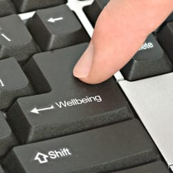 person pressing a button on a computer keyboard