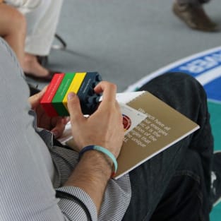 man holding insights discovery block red yellow green and blue2