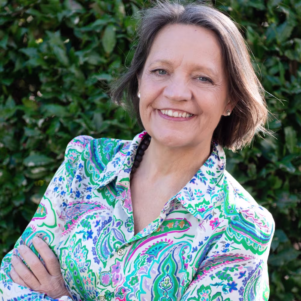 Photo of Michelle wearing coloured blouse