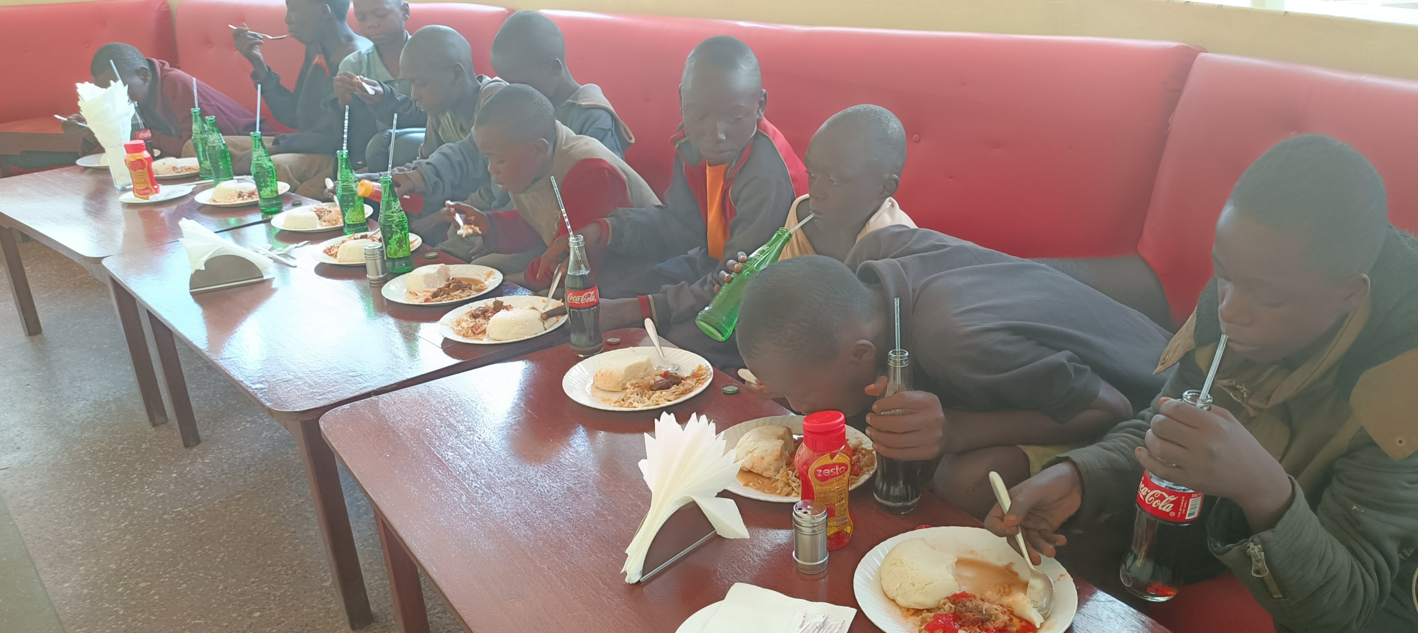 Sharing a meal with street children in Kitale