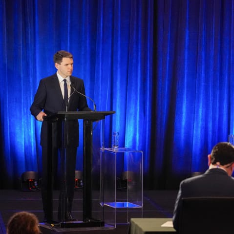 James Talarico, left and Jasmine Crockett seen on stage during a debate.