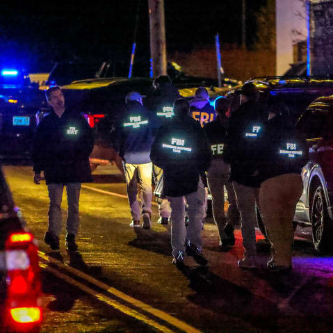 A team of FBI agents arrive on the scene at the Extra Space Storage facility in Salem, N.H.