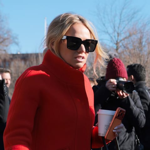 Trisha McLaughlin talks to Kristi Noem as they walk away.