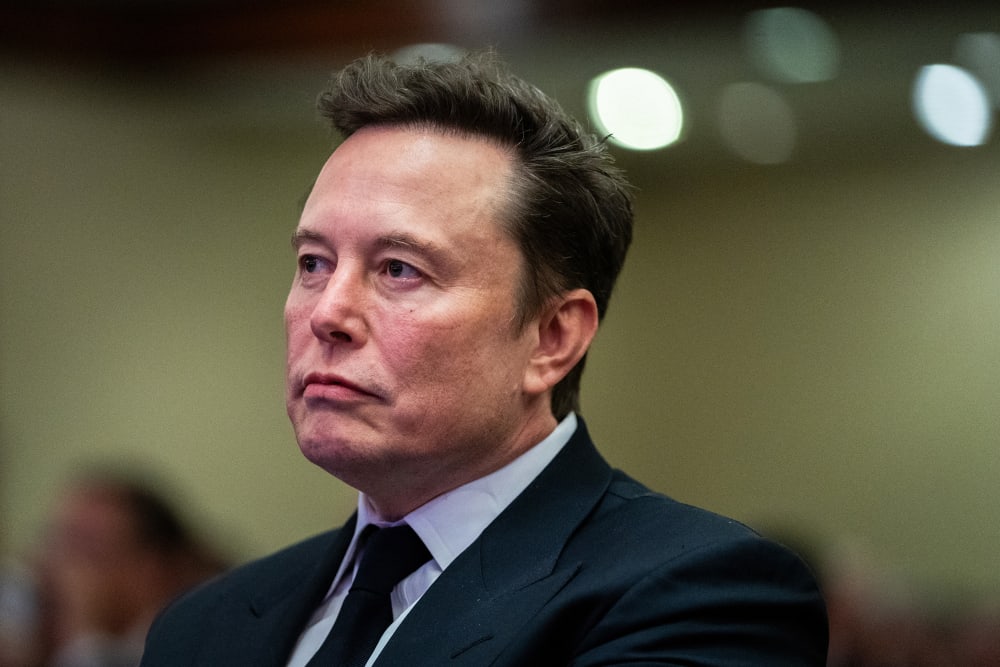Elon Musk without much expression on his face.