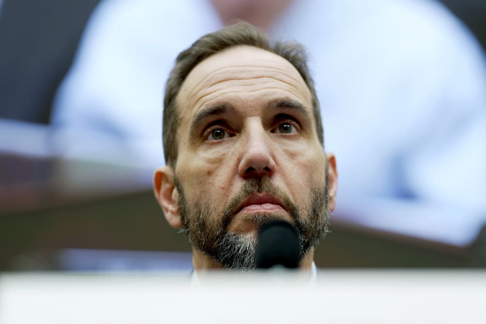 A closeup of Jack Jmith's face is photographed from below.