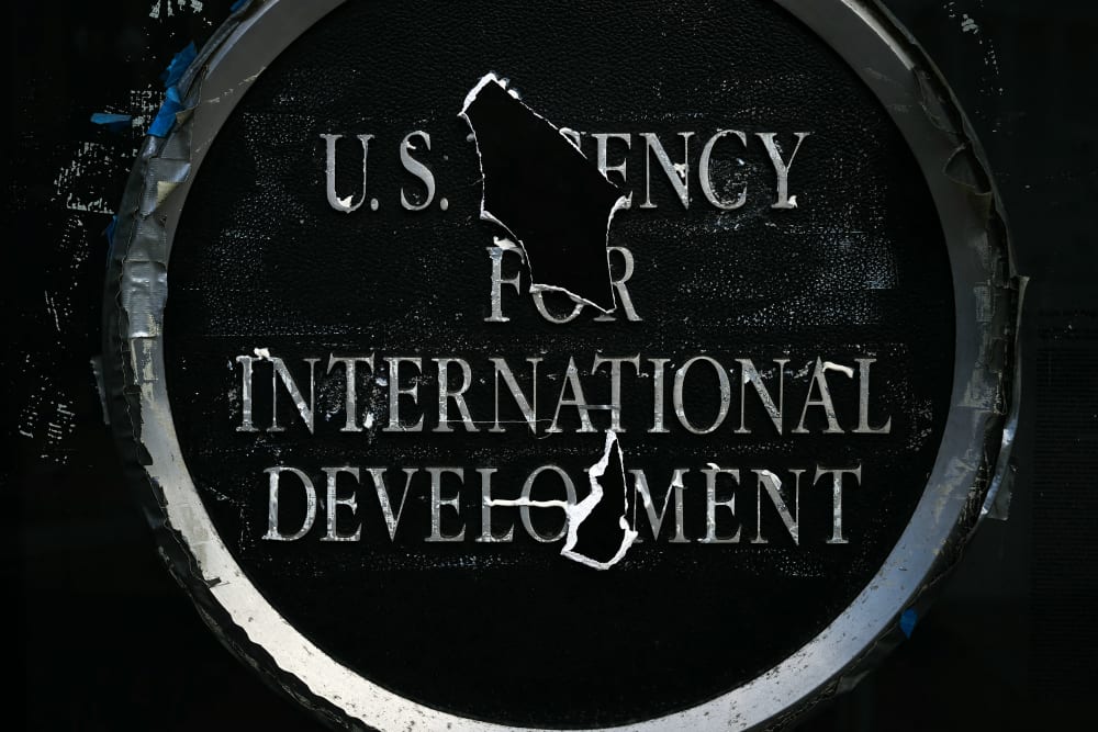 Remnants of signage for the US Agency for International Development (USAID) on the facade of the Ronald Reagan Building and International Trade Center building on Dec. 29, 2025 in Washington, D.C.