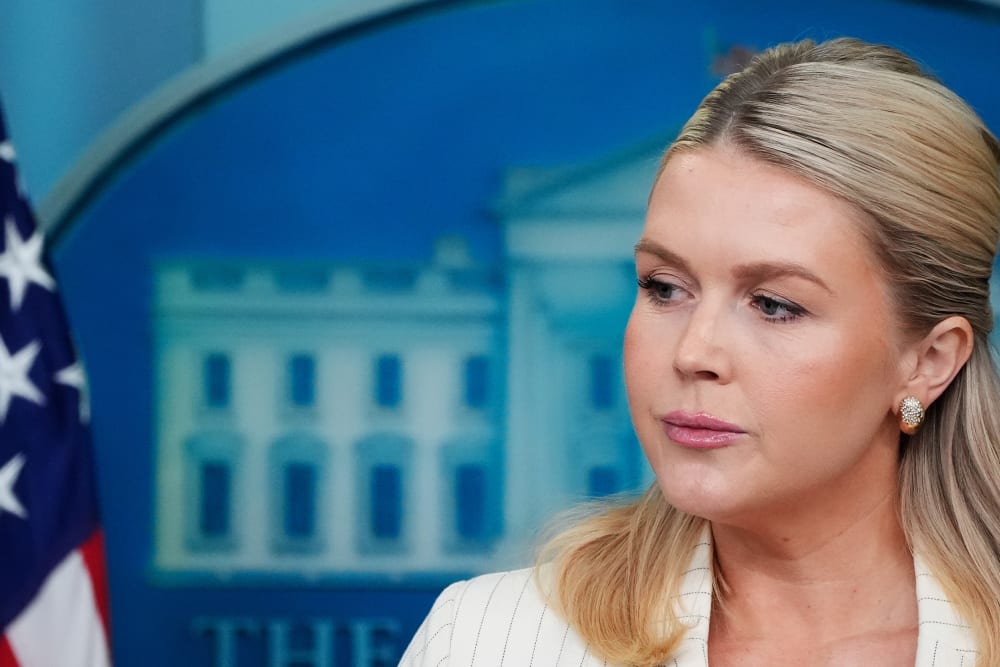 Leavitt is seen on the right side of a closeup frame.