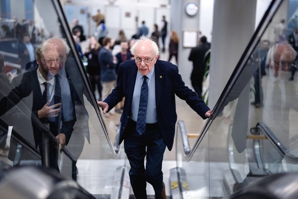 Bernie Sanders going up the escalators.