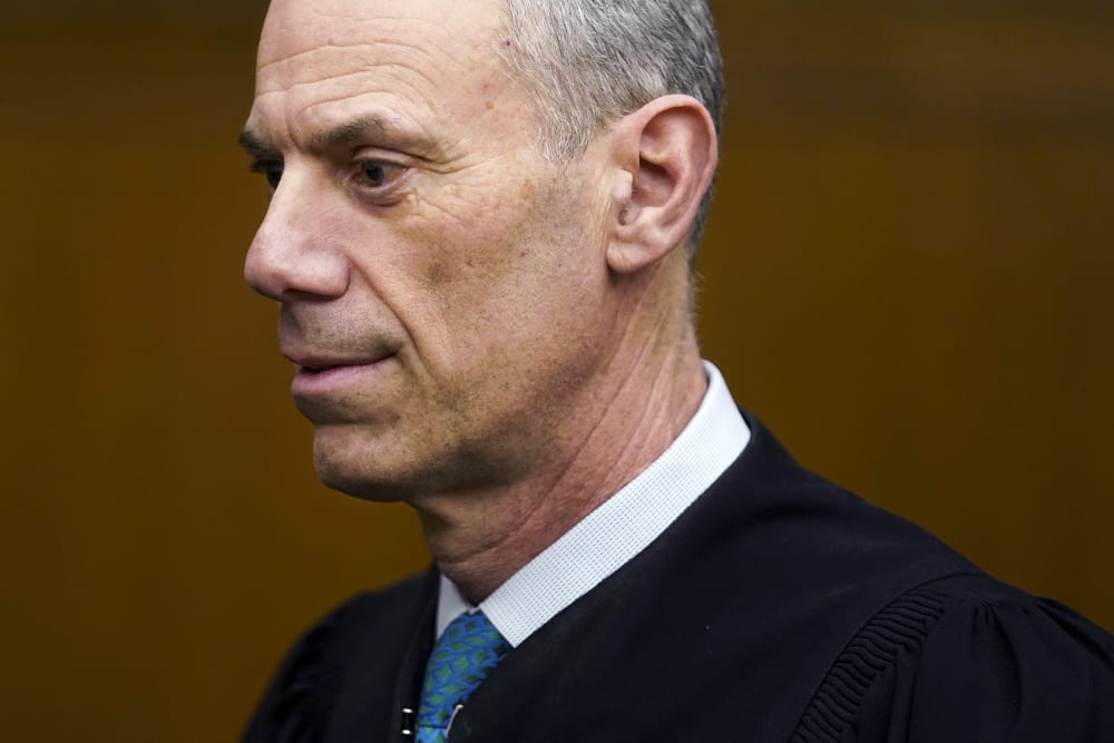 Judge Boasberg's profile is seen in a closeup frame, top of his head cropped out.