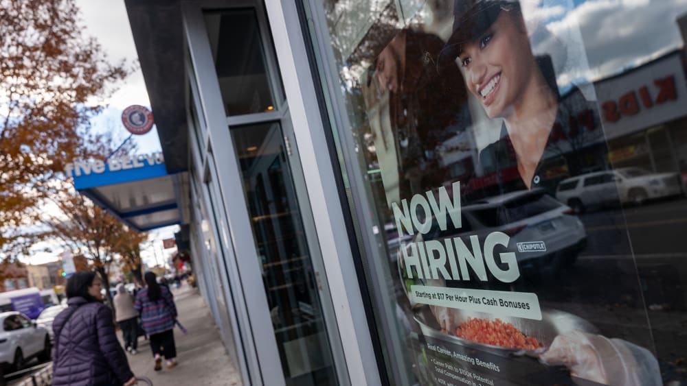 A "Now Hiring" sign is seen at a Chipotle in NY.