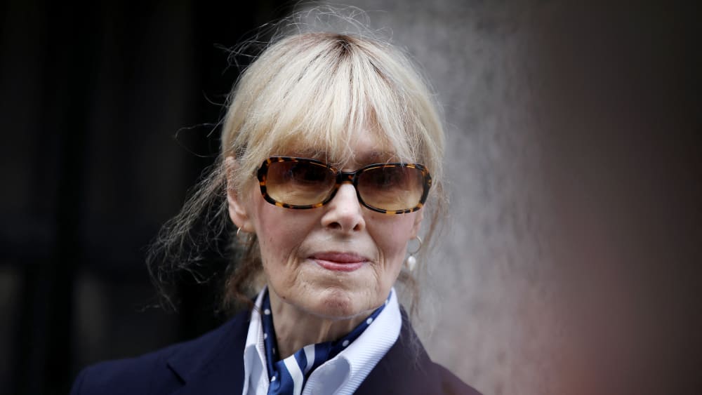 Jean Carroll seen in closeup shot wearing sun glasses.