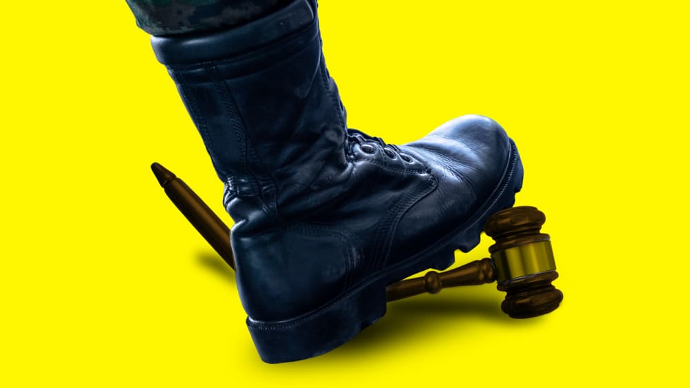An illustration of a black military style book breaking a judge's gavel