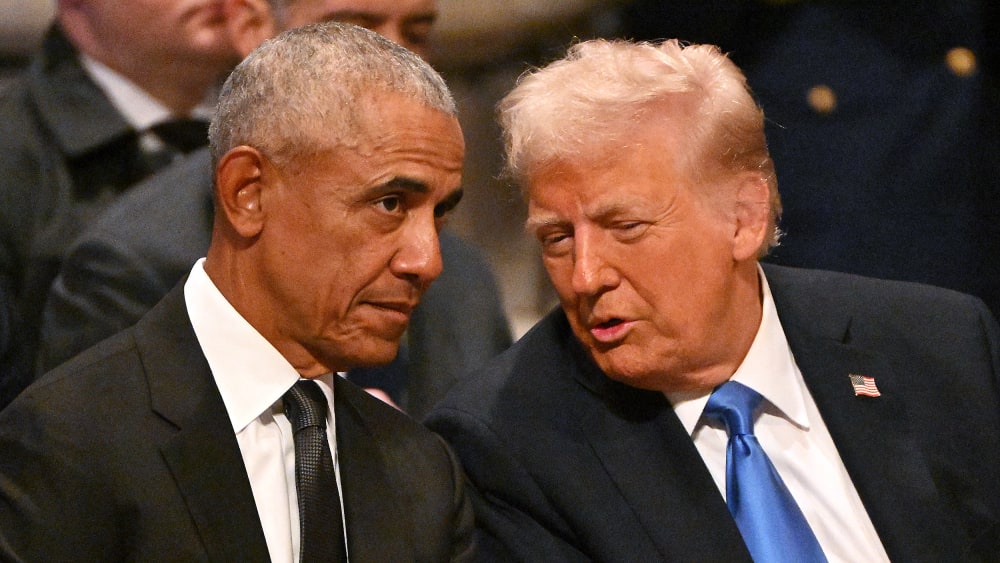 Barack Obama speaks with Donald Trump at the Washington National Cathedral.