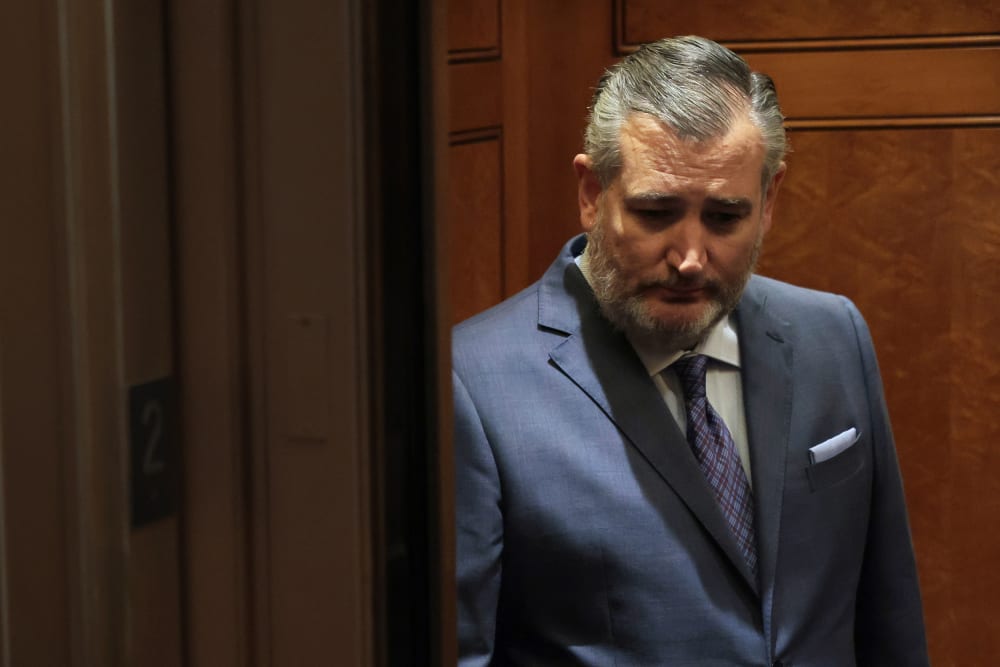 Texas Sen. Ted Cruz looks down as he stands in an elevator in the U.S. capitol.