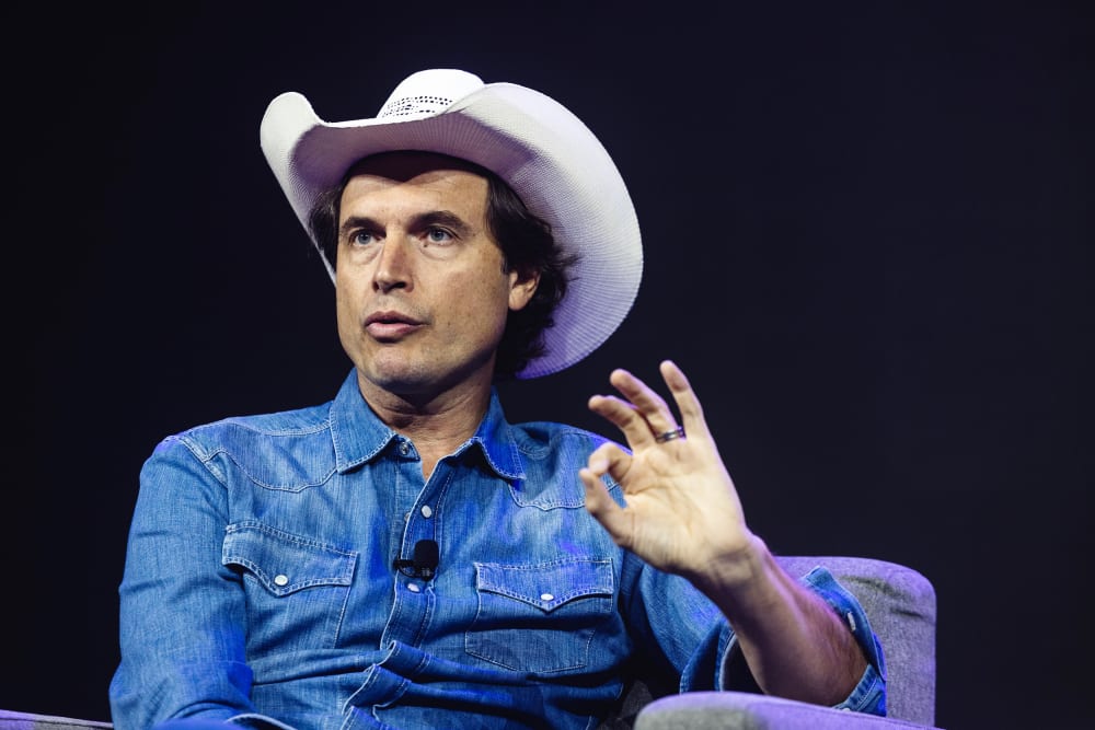 Kimbal Musk sits at the stage.