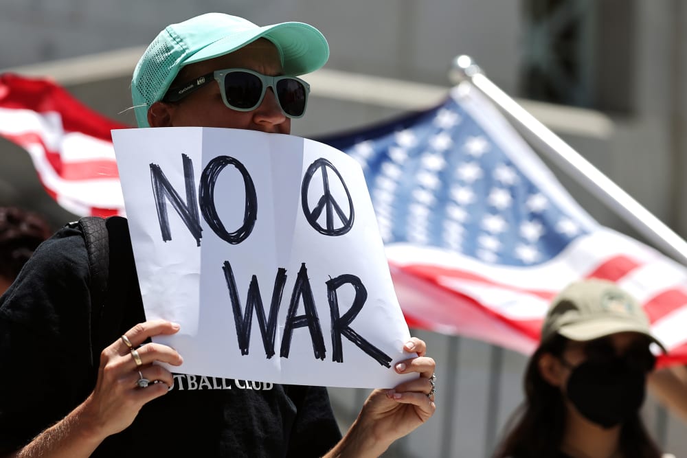 Demonstrators gather outside City Hall during a rally opposing the United States' strikes on Iran on June 22, 2025.