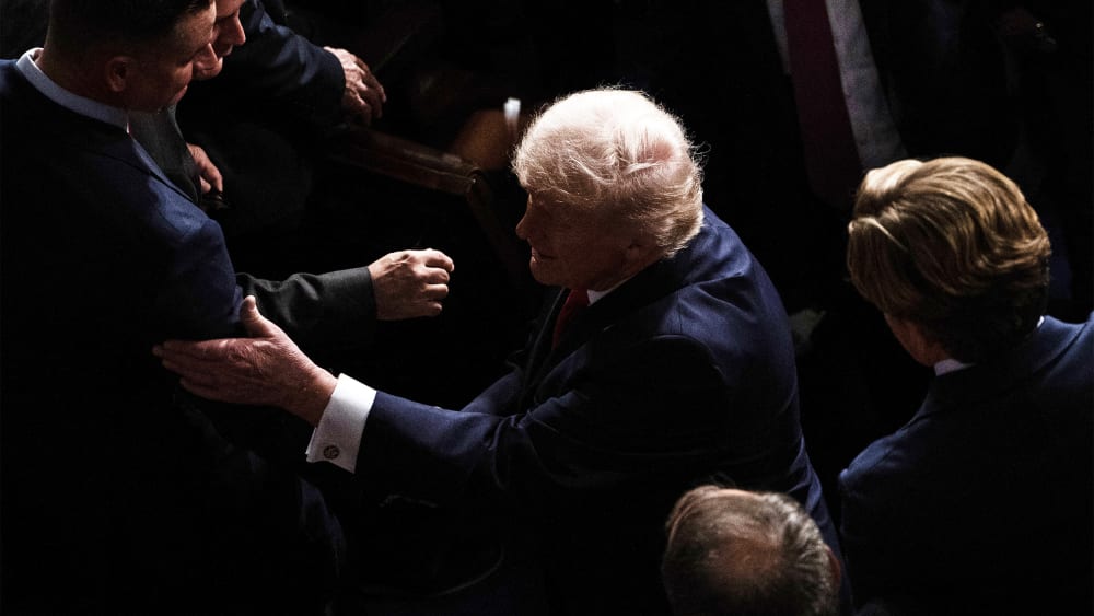 President Donald Trump leaves the House Chamber after concluding his State of the Union address at the US Capitol.