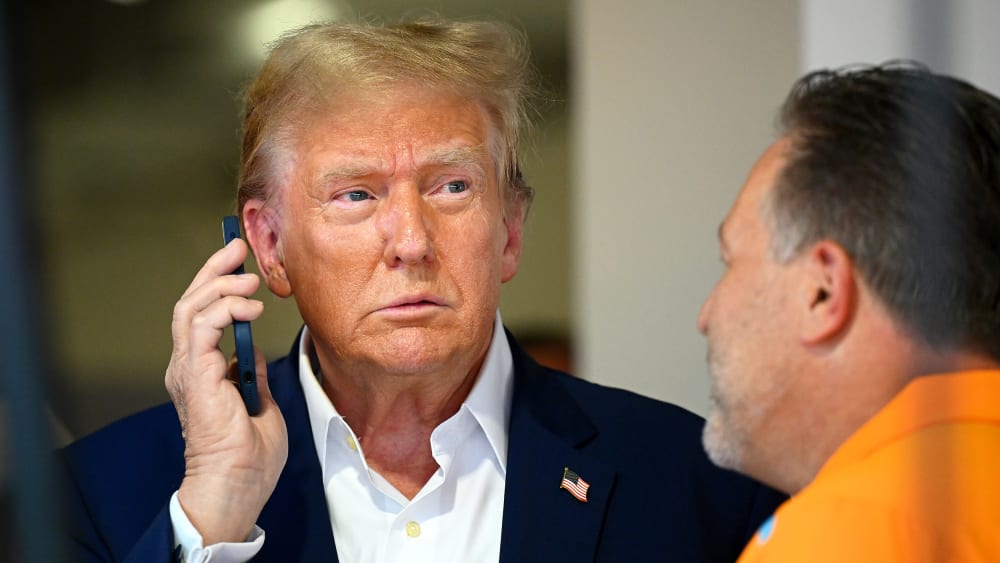 Donald Trump talks on the phone.