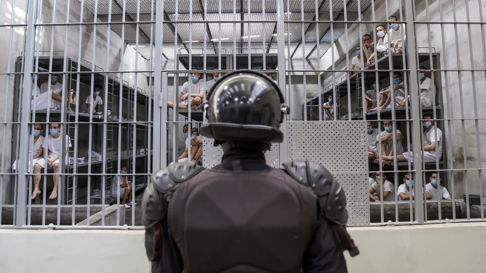 A prison officer guards a cell at the maximum-security penitentiary CECOT on April 4, 2025, in El Salvador.