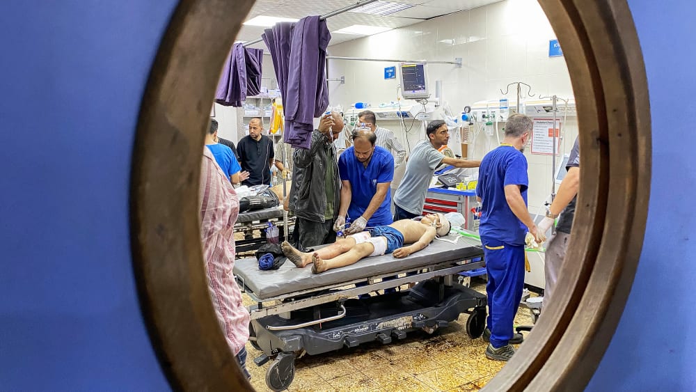 Palestinians who were injured in Israeli fire receive care at Nasser hospital in the southern Gaza Strip.