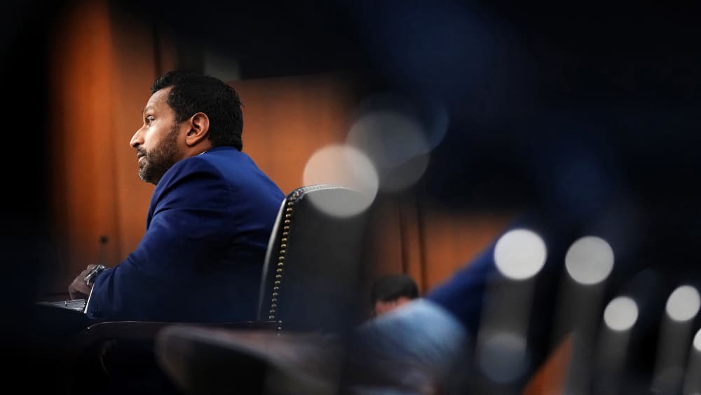 Kash Patel is seen from bottom left side.