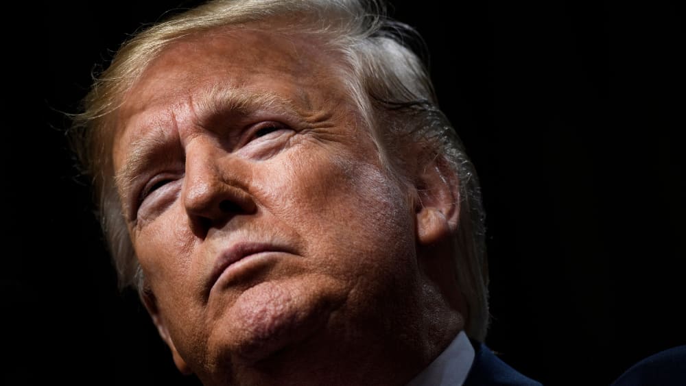 A close-up of Donald Trump looking stoic.